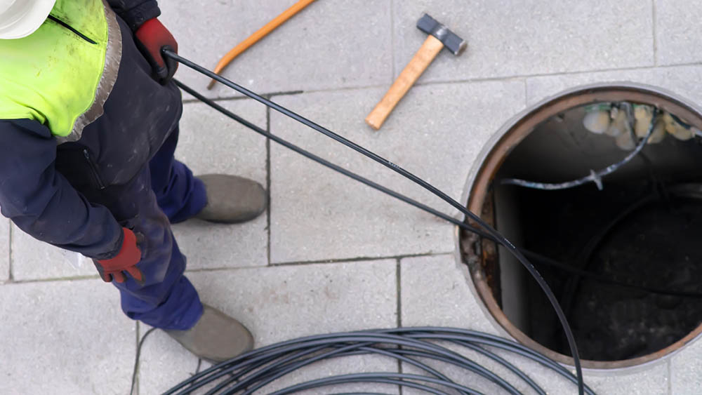 technician preparing hydro jetting equipment