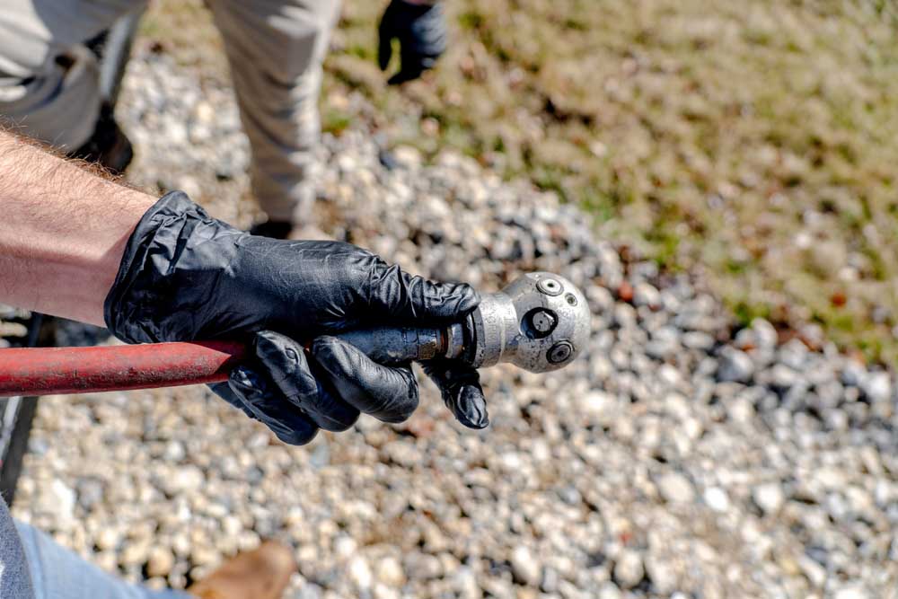 technician preparing hydro jetting equipment